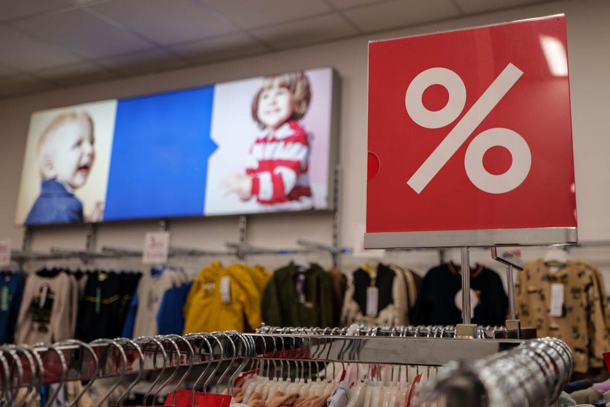 Organized discount store layout with tiered pricing strategy showing $1, $3, and $5 sections